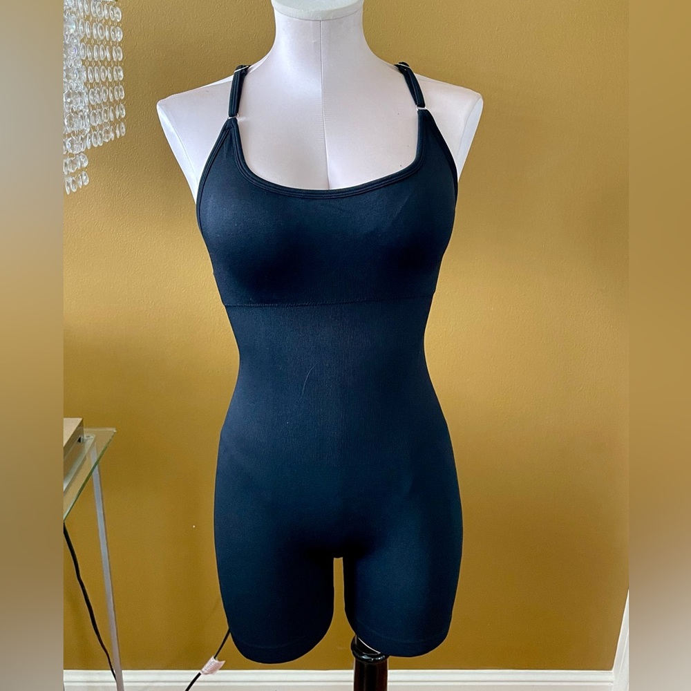 Solid black unitard rompers.